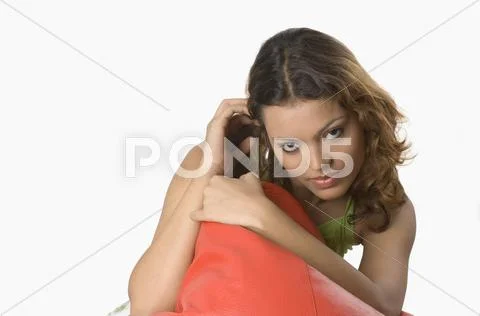 Portrait of a woman holding bean bag Stock Photos