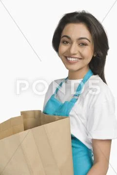 Portrait of a woman holding a paper bag Stock Photos