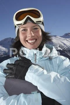 Portrait Of Woman Holding Snowboard