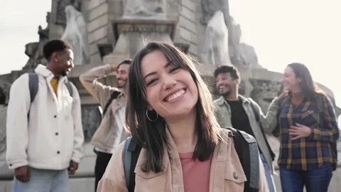 Portrait of woman looking at the camera. Group of young students of university Stock Footage 169674239