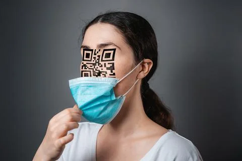 Portrait of a woman with a QR code instead of eyes and nose. Dark background. Stock Photos