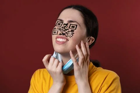 Portrait of a woman with a QR code instead of eyes and nose, removing protect Stock Photos