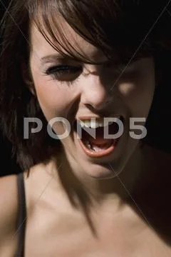 Portrait of a woman screaming Stock Photos
