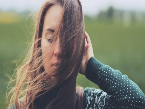 Portrait of Woman Standing on the Wind. SLOW MOTION 4K DCi. Stock Footage