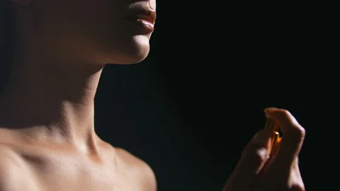 Portrait of woman using perfume sample Stock Footage 105027441