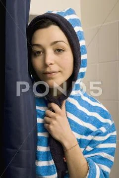 Portrait of a woman wearing a striped bathrobe Stock Photos