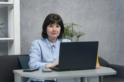 Portrait of woman while working at  computer. Business woman, entrepreneur, f Stock-Fotos