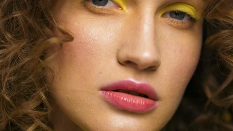 Portrait of Woman’s Face, Colorful Model looking at Camera, having nice Makeup. Video stock 146492014