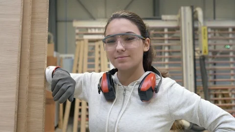 Portrait of woodwork apprentice standing in carpenter shop Stock-Footage 123162912
