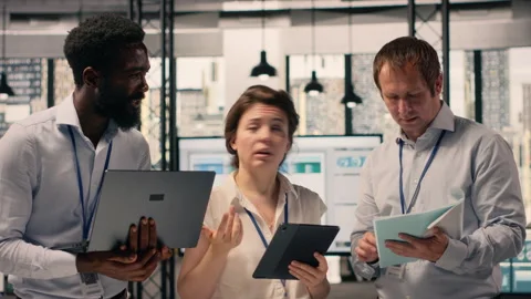 Portrait of work team analyzing data analysis results and KPI metrics Stock Footage 329324100