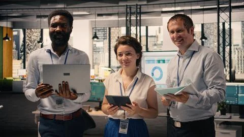 Portrait of work team analyzing data analysis results and KPI metrics Stock Photos
