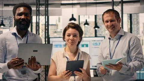 Portrait of work team analyzing data analysis results and KPI metrics Stock Photos