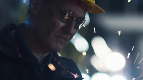Portrait of Worker with Angle Grinder does Metalworking in Industrial Environmen Stock Footage