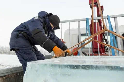 Portrait of a worker in a black hat unloading Stock Photos