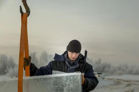 Portrait of a worker in a black hat unloading 스톡 사진