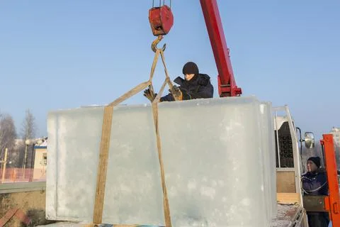 Portrait of a worker in a black hat unloading 스톡 사진