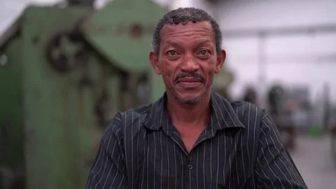 Portrait of Worker on Factory on background Vídeos de archivo 84790222