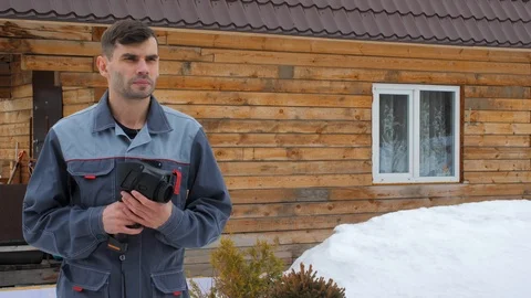 Portrait of the worker of the house which is carrying out an inspection by the Video stock 106669730