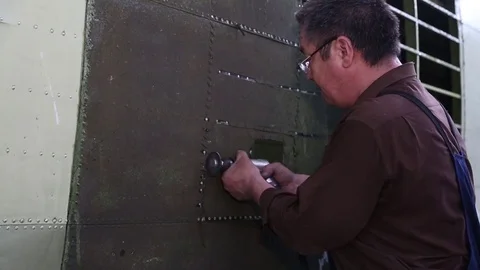 Portrait of a worker repairs powerful steam turbine. Stock Footage 81205863