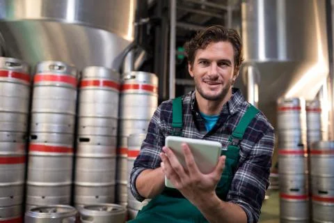 Portrait of worker using tablet computer in warehouse Stock Photos