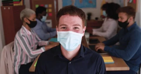 Portrait of worker wearing face protective mask during coronavirus outbreak Stock Footage 141049956
