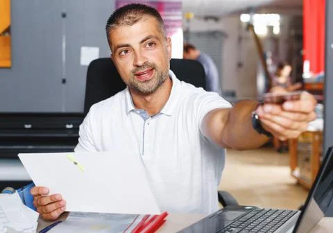 Portrait of a working man at printer studio Stock Photos