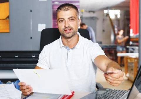 Portrait of a working man at printer studio Stock Photos