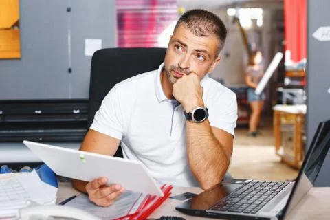 Portrait of a working man at printer studio Stock Photos