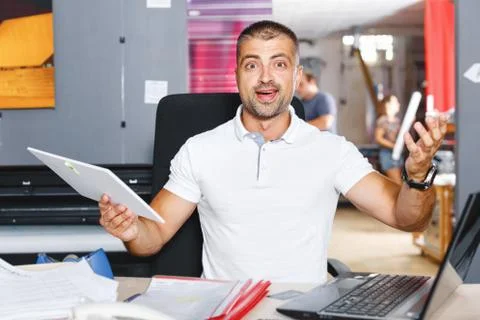 Portrait of a working man at printer studio Stock Photos