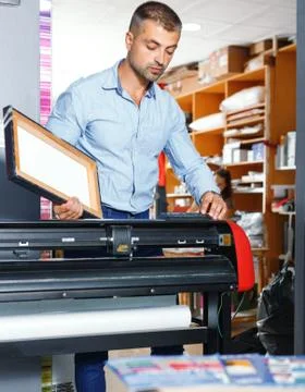 Portrait of a working man at printer studio Stock Photos