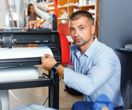 Portrait of a working man at printer studio Stock Photos