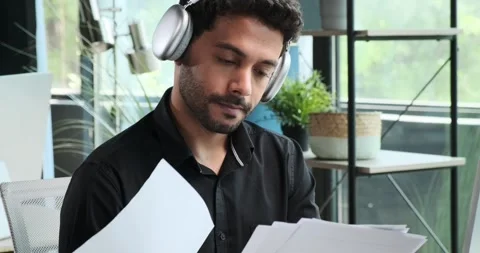 Portrait of a Working Middle Eastern Businessman in Headphones Video stock 254439724