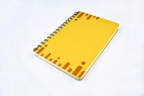 Portrait of an yellow note book diary with brown stripes before a white backg Stock Photos