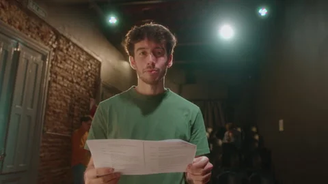 Portrait of Young Actor with Play Script on Theater Stage Stock Footage 247832750