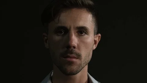 Portrait of young angry man looking in camera Stock Footage 80303604