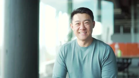 Portrait of young asian man freelancer office worker teacher in modern room  Stock Footage 166233043