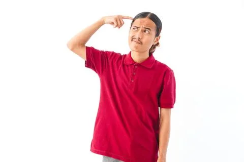 Portrait of a young Asian man with long hair wearing a red shirt, looking c.. Stock-Fotos