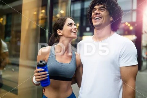 Portrait of young attractive happy fitness couple Stock Photos