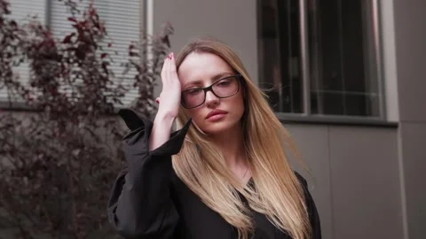 Portrait of young attractive look at the camera at urban city with long blond Stock Footage 242780243