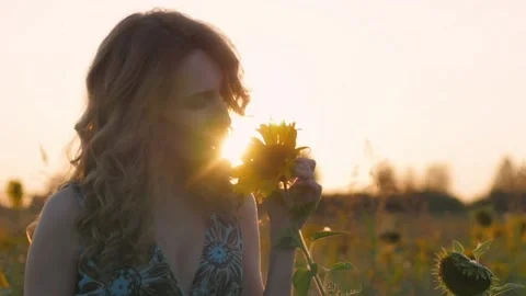 Portrait of a young attractive woman with red hair and a blue dress in a field Stock-Footage 152917841