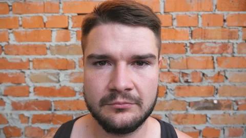 Portrait of young bearded guy with confident and serious expression on his face Stock Footage 119413260