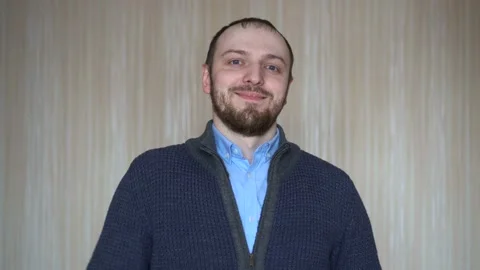 Portrait of young bearded man gesture thumbs up indoors Stock Footage 103112784