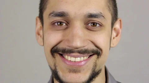Portrait of a young bearded man. Smiling looking at the camera. Stock Footage 73720539