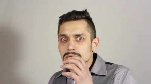 Portrait of a young bearded man was frightened. gesture Stock-Footage 73685579