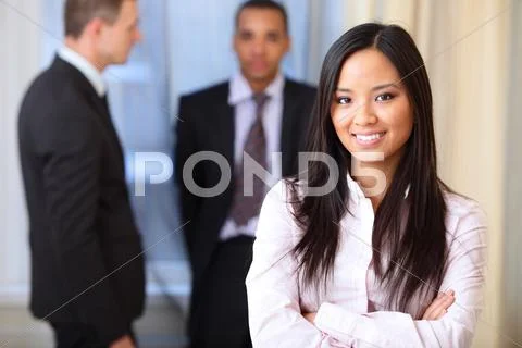 Portrait of a young beautiful asian woman in a business environment Stock Photos