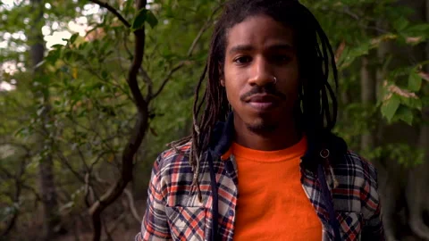 Portrait Young Black Man Looking At Camera While in Forest Stock Footage 142013679