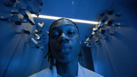 Portrait of Young Black Man Staring into Camera under Cctv Surveillance Video stock 337413245