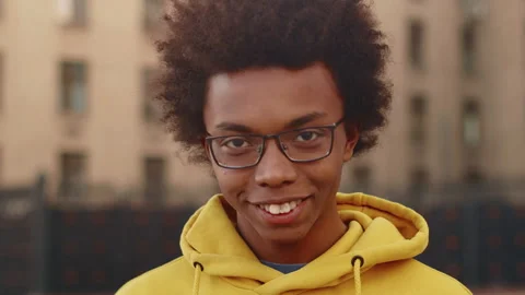 Portrait of a young black programmer in glasses close up who raising his head Stock Footage 262072686