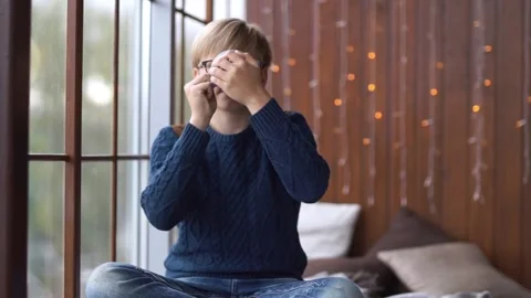 Portrait of a young blond guy with a mug in his hands. Stock Footage 161153335