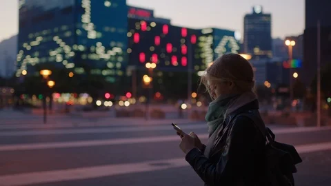 Portrait of young blonde woman texting browsing using smartphone social media Stock Footage